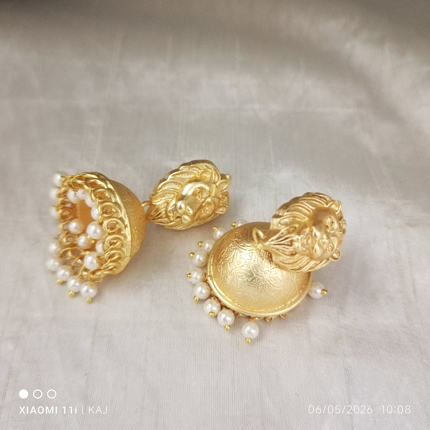Brass base lion top jhumki earrings
