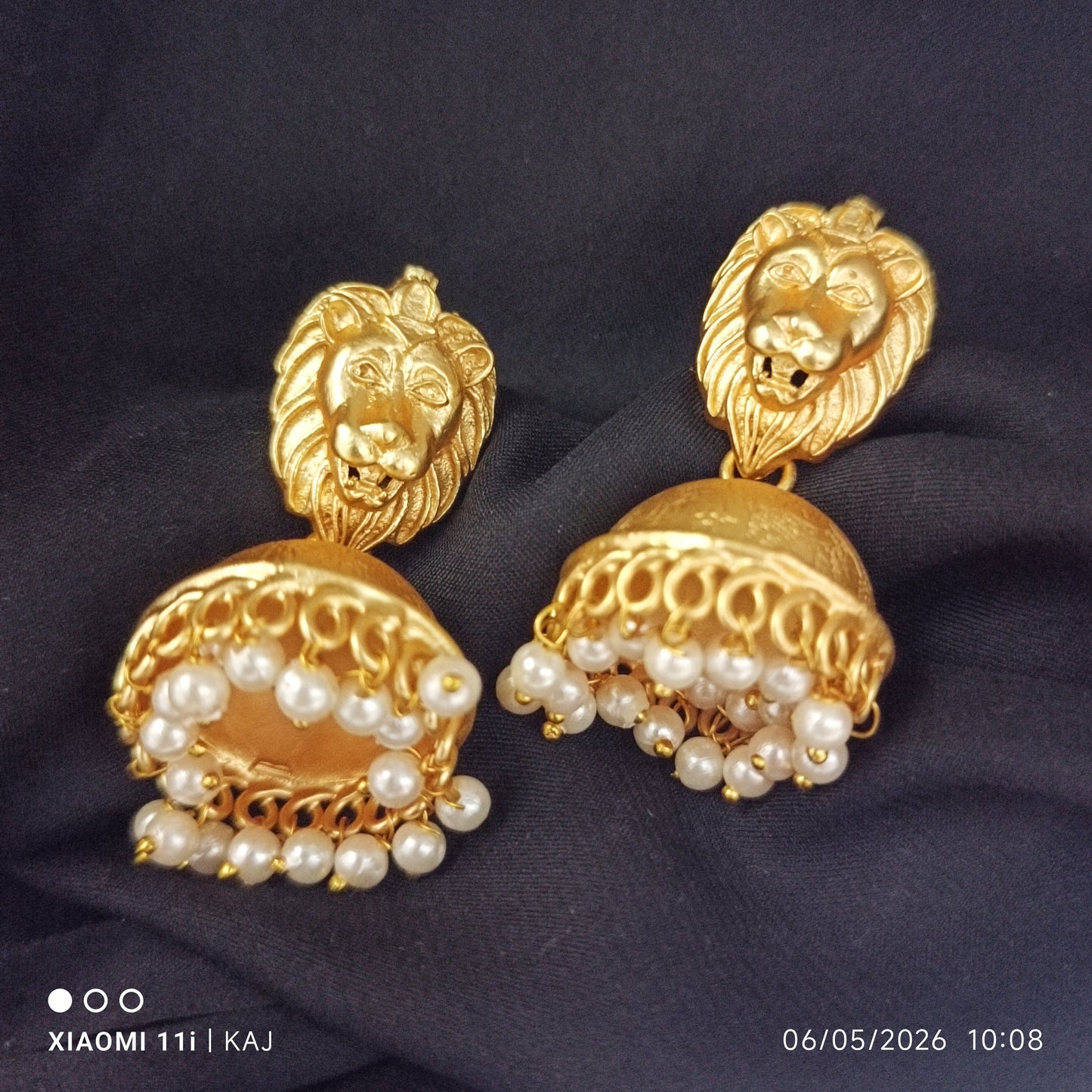 Brass base lion top jhumki earrings