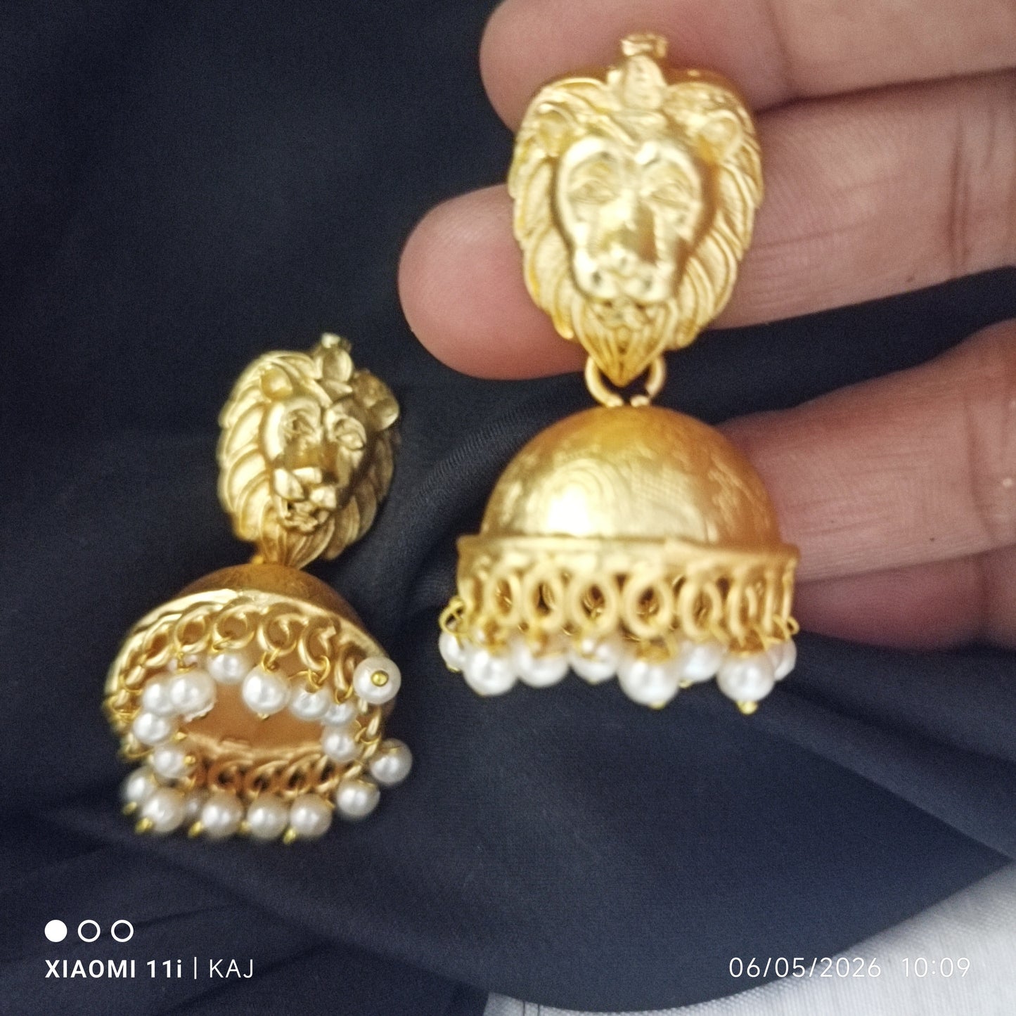 Brass base lion top jhumki earrings